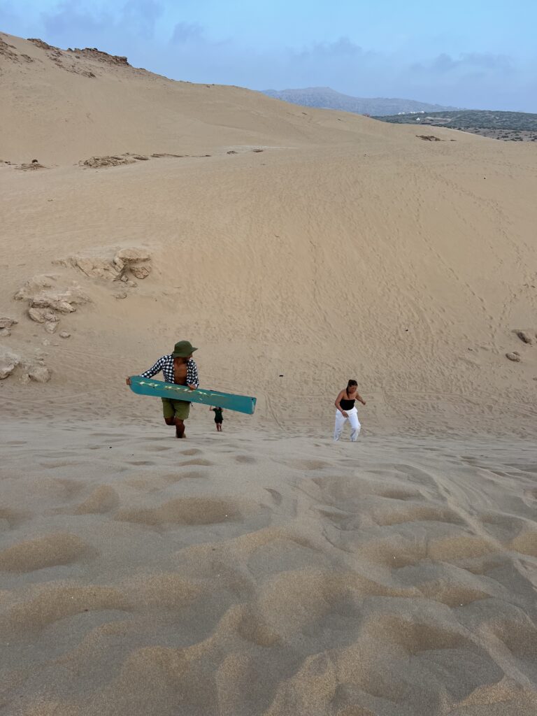 Experiencing the sand boarding with us